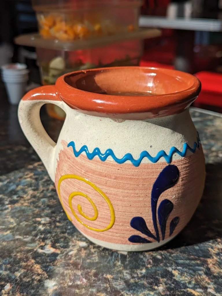 Hand-painted clay mug at Las Delicias de Maria