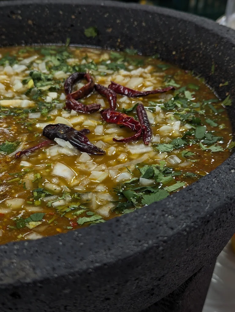 Fresh salsa served in a traditional molcajete