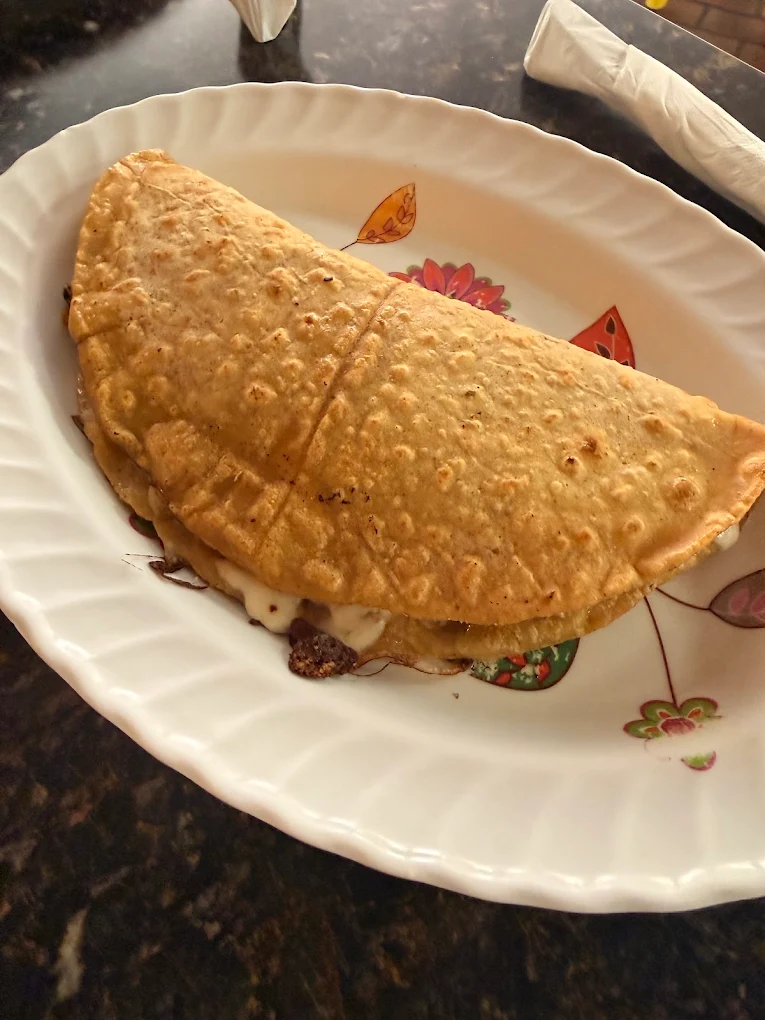 Large folded quesadilla on a plate